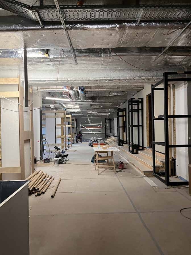 Construction site: bare shell with drywall, timber battens and steel frames