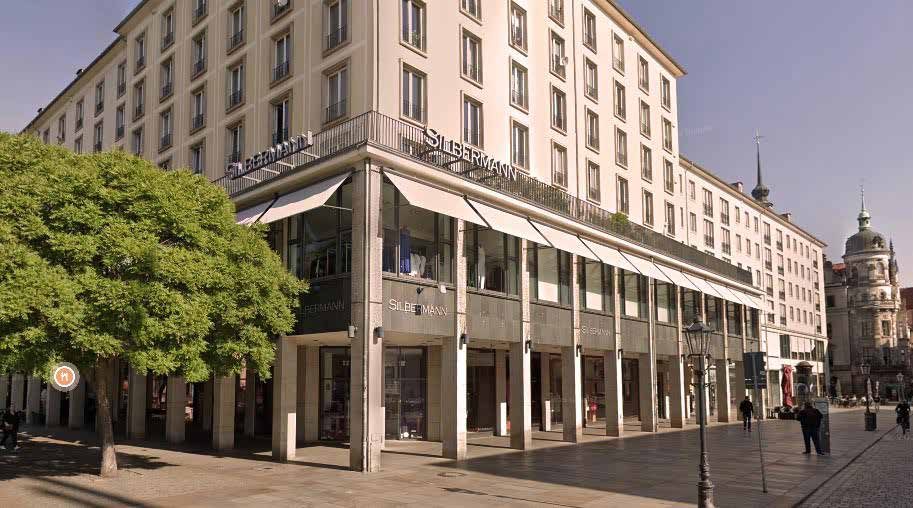 The site in Dresden: a corner building with arcades on a city-centre street